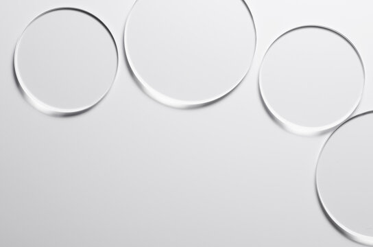 Glass circles on a white background. A template for placing samples of cosmetics or medical products or food.