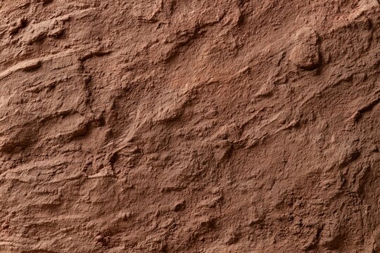 The Red Rock Surface Texture Revealing Rough Sandstone Details and Patterns