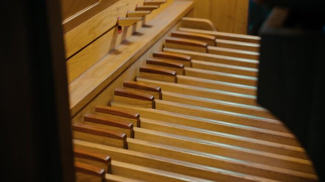 Pedals of a massive pipe organ in an Italian Christian cathedral
