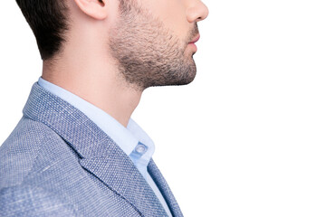 Side view cropped half face  profile portrait with copy space of stunning manly manager in suit with serious expression isolated on grey background © deagreez