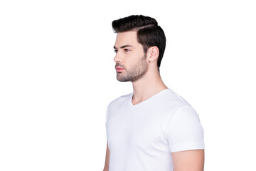 Obraz premium Portrait of half turned stunning man in white t-shirt with modern hairstyle soft smooth skin, isolated on grey background