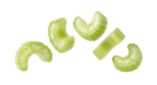 Fresh celery stalk slices falling on transparent background
