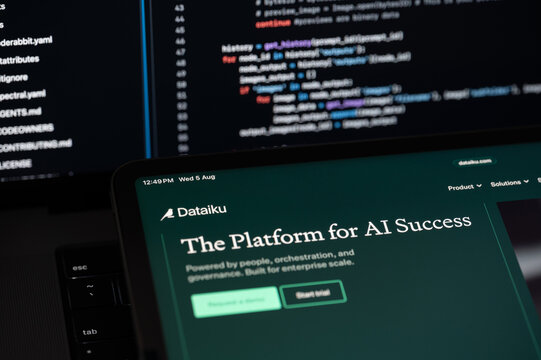 Dataiku Ai company web page on program code background