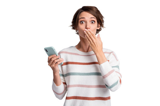 Photo of guilty young woman dressed striped pullover holding modern device arm cover mouth isolated grey color background