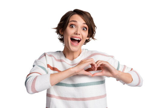 Photo of impressed young lady wear striped sweater open mouth showing fingers heart isolated grey color background