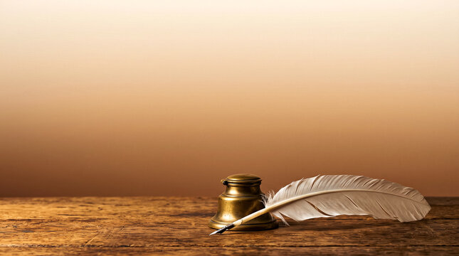 Vintage white quill pen and brass inkwell on wooden desk with copy space. Concept of historic law, legislation, constitution, and legal signing.