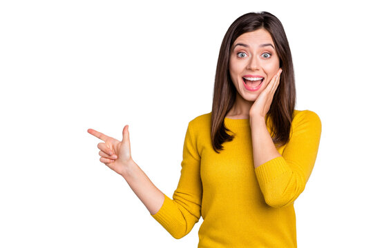 Photo of young happy shocked amazed excited girl hold hand cheek point finger copyspace isolated on grey color background