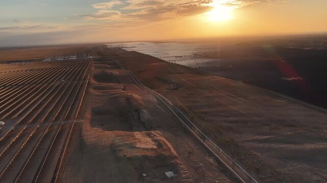 Aerial View of Utility-Scale Solar Farm with Battery Energy Storage System in Arid Desert