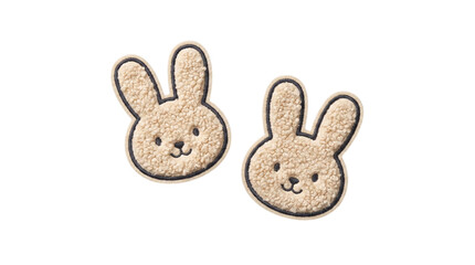Two fluffy bunny face embroidered plush patches on a transparent background © Vitalo4ok