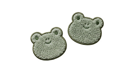 Two fluffy green frog face embroidered plush patches on a transparent background © Vitalo4ok