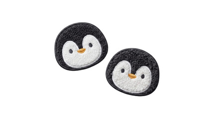 Two fluffy penguin face embroidered plush patches on a transparent background © Vitalo4ok