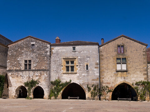 Monpazier village - Aquitaine - France - July 6 2026 : Beautiful, historic Place des Cornieres. The old market square at the heart of this medieval town. Handsome stone town houses.
