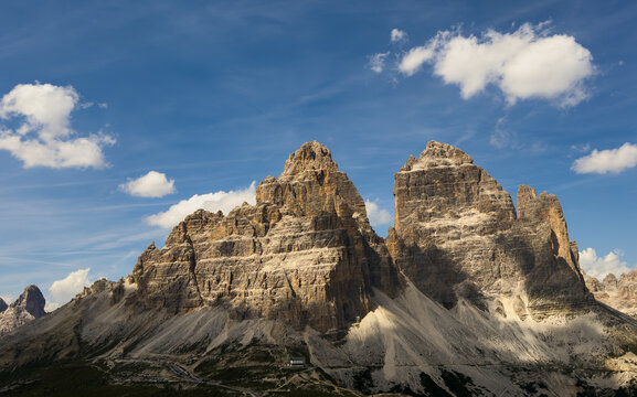 Mountain landscape panorama Tre Cime Mount against a blue summer background. 
