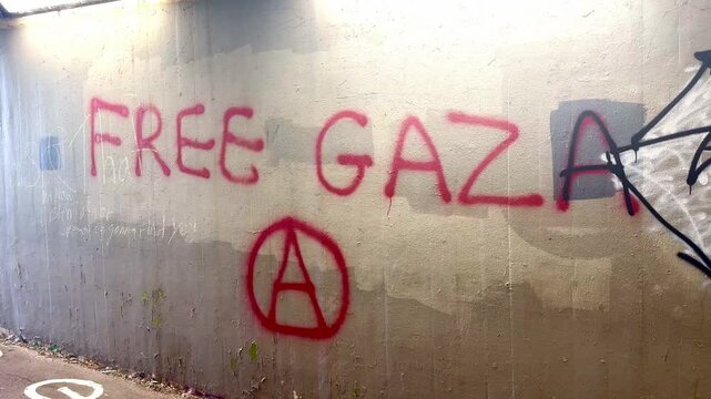 Brighton, East Sussex - August 12th 2026: Free Gaza message Graffiti on wall of subway near Duke's Mound