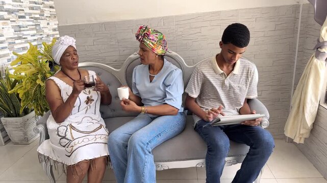 Multigenerational family sitting together at home