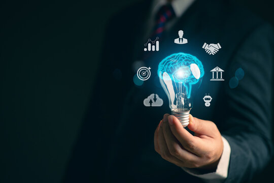 Businessman holding a light bulb. Network. Online business. Online business networking.. New ideas. Innovative ideas for online marketing...