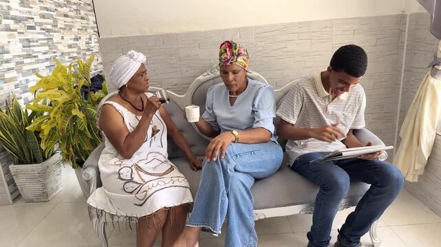 Multigenerational african american family relaxing on sofa