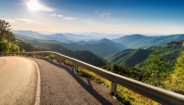 scenic mountain road overlook with guardrail and distant valley view