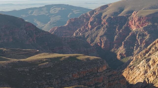 Aerial of winding dirt road mountain pass, Swartberg pass, South Africa
