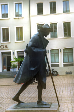 Speyer, Germany, 08-07-26. Bronze sculpture by artist Martin Mayer is known as St. James Pilgrim. The statue depicts a pilgrim traveling the Camino de Santiago,.