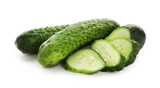 Whole and cut fresh cucumbers isolated on white