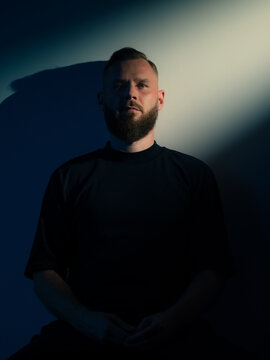 Man portrait in studio with beam light 