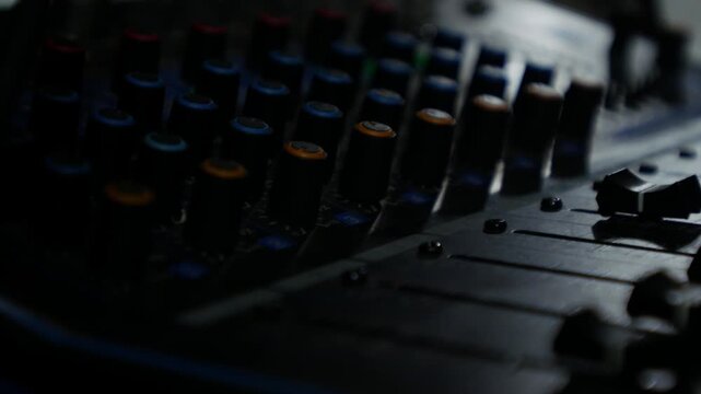 Professional DJ Sound Mixer Panel with Mute Solo Buttons and Sliders Close Up