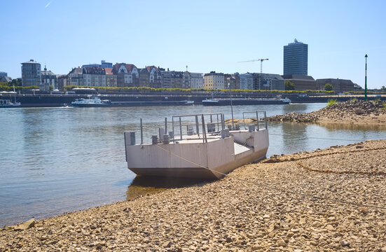 D&uuml;sseldorf, Germany,low stream gauge of rhine river.Water shortage, drought, climate change,global warming concept, due to the drought, ships can only operate with reduced cargo.