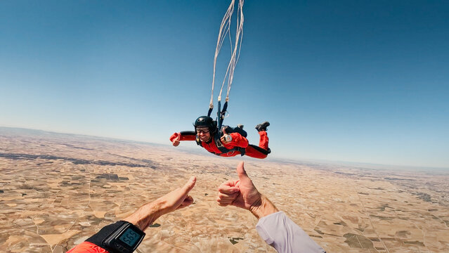 AFF instructor giving a thumbs up during canopy flight