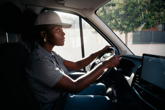 Female delivery driver working in a logistics van