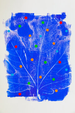 Modern abstract art with leaf-shaped imprints and coloured dots