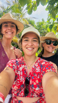 Three friends enjoying outdoor tropical vacation in Mexico