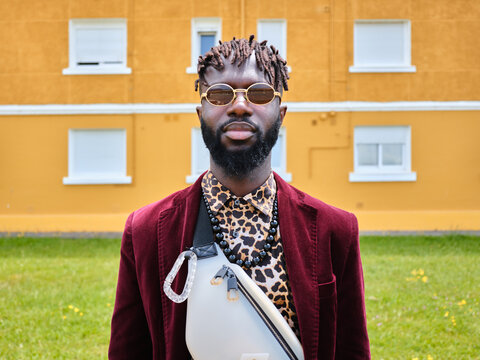 Black man wearing stylish fashion in urban setting