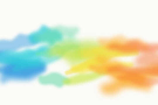 Blurred rainbow colored watercolor splashes on a white background, creating a soft, and vibrant abstract, artistic texture for work