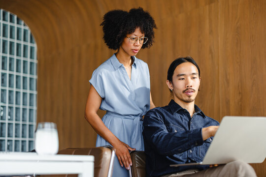 People Work Together in Modern Office Space During the Day