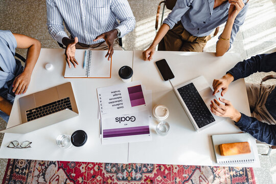 Team Members Discussing Tasks and Sharing Ideas in an Office