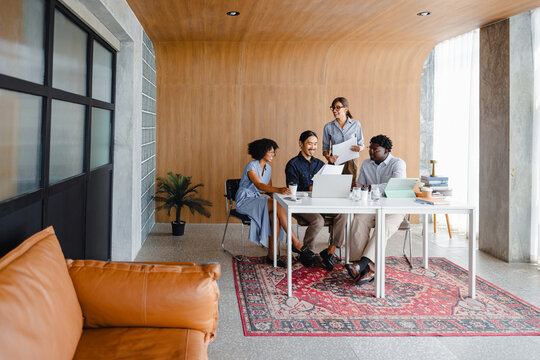 Group of People Working Together in a Modern Office Space