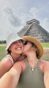 Happy couple enjoying a vacation trip to Chichen Itza Mexico