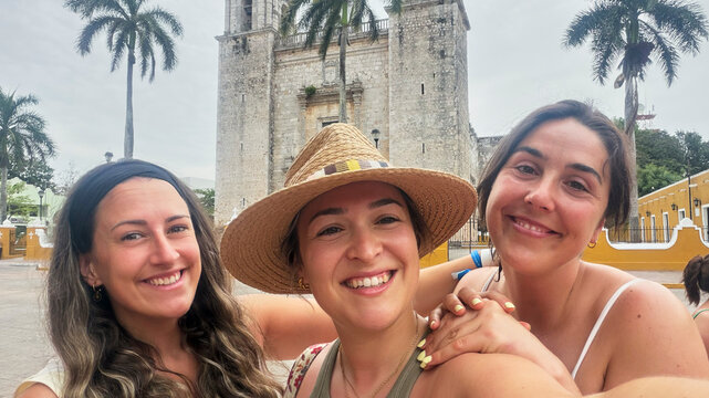 Friends enjoying Mexico trip posing at Valladolid Cathedral