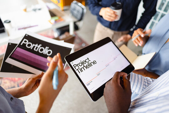 Discussing Project Timeline and Portfolio in Office Setting