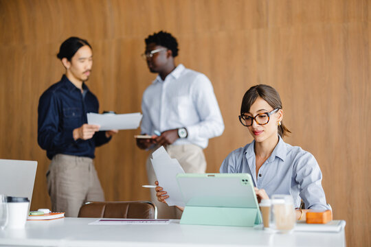 People Working Together in an Office Space on a Project