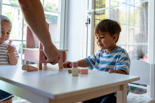 Children Playing With Wooden Toys