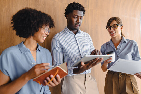 Group of People Discussing Ideas in an Office Setting During the Day