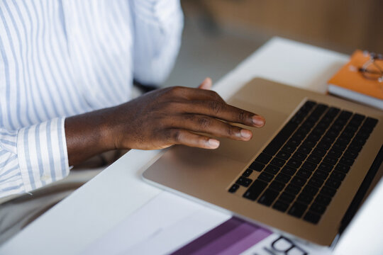 Person Using Laptop at Desk During Work Hours