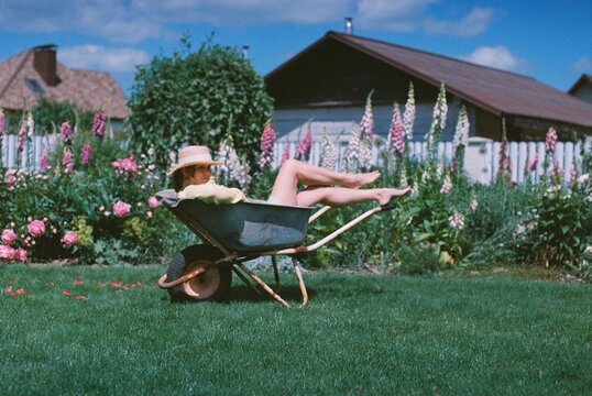 A woman is relaxing in the garden.