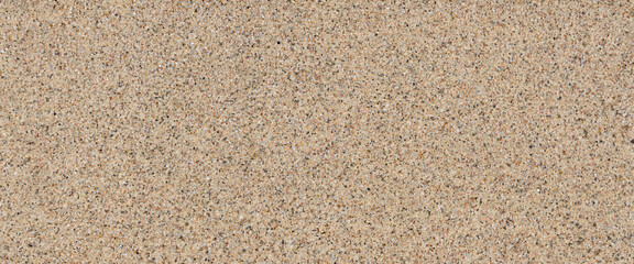 Plakat A detailed textured background of coarse sand with small pebbles and dark grains providing a natural and granular surface for design