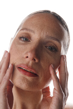 Woman Touching Her Face in a Beauty and Skincare Setting