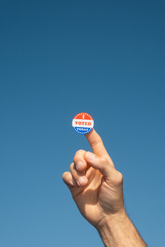Hand with I Voted Today sticker