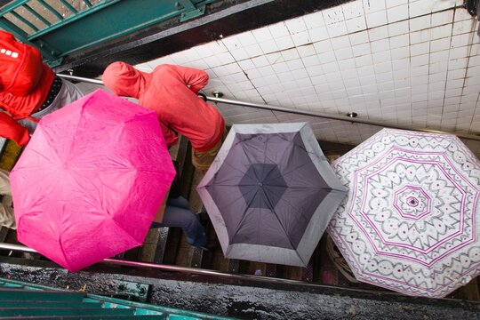 Getting out of the rain with umbrellas