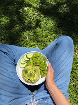 POV holding healthy meal outdoors